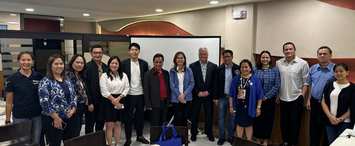 Beaudoin and Lim meeting with Tarlac Agriculture University. Attendees include: Kay Lim (International Market Development Manager at Olds College), Max P. Guillermo (President of Tarlac Agricultural University), Susan A. Yap (Governor of Tarlac), Dennis Beaudoin (Dean of School of Trades & Skills at Olds College), Arnold E. Velasco (Tarlac State University President).